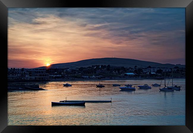 Sunset over Swanage and Purbeck Hills  Framed Print by Darren Galpin