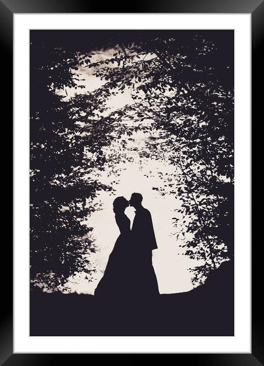 Romantic bride and groom kissing Framed Mounted Print by Damian K