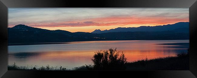 Sunset over Lake Viñuela Framed Print by Barry Foote