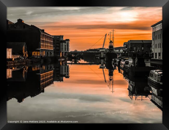 The Sun Setting over the Docks  Framed Print by Jane Metters