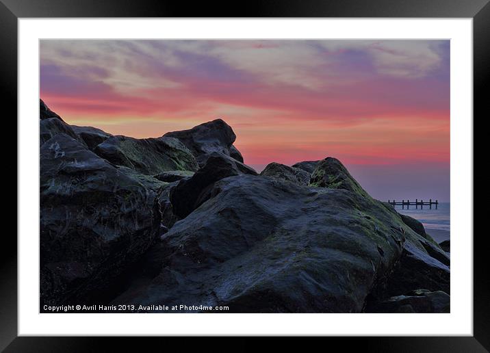 Happisburgh sea defences at sunset Framed Mounted Print by Avril Harris