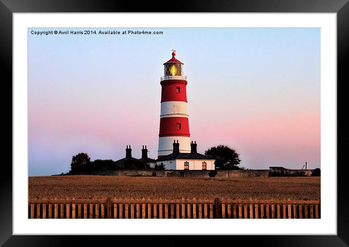 Happisburgh lighthouse shining Framed Mounted Print by Avril Harris