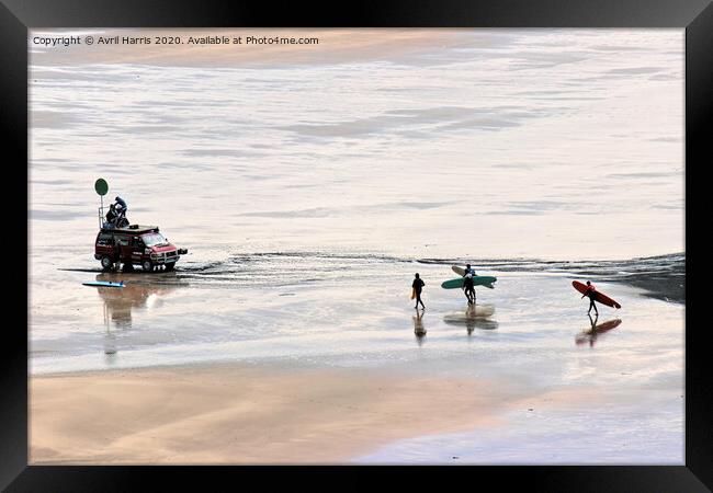 Surfers on woolacombe beach Framed Print by Avril Harris