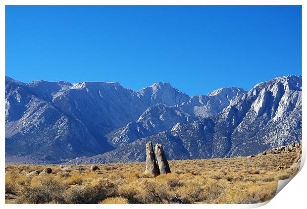 Bizarre rock tower couple and Sierra Nevada, Calif Print by Claudio Del Luongo