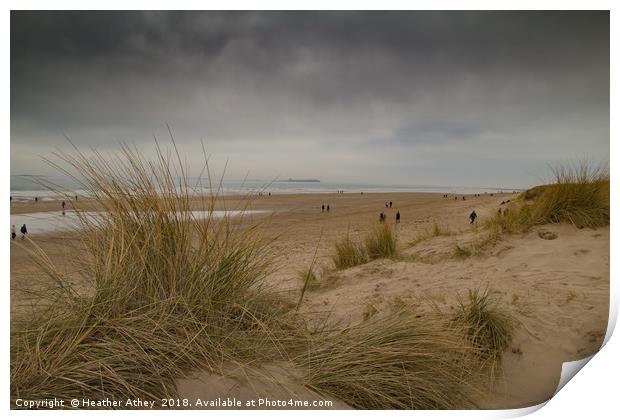 Moody day at Bamburgh beach, Northumberland Print by Heather Athey