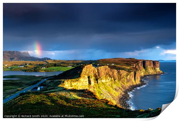 The end of a rainbow at sunrise, the cliffs of Kilt Rock with loch Mealt behind. Print by Richard Smith