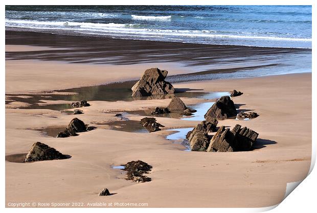 Puddles and Rocks at Putsborough Sands Print by Rosie Spooner