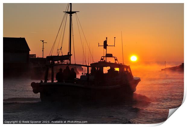 A fishing boat heads out at sunrise Print by Rosie Spooner
