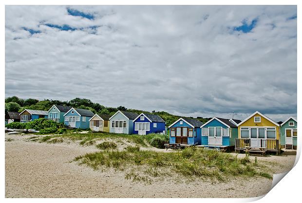 Beach huts on Mudeford Spit Print by Dan Ward