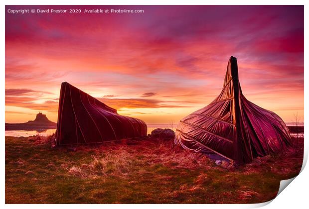 Boat huts and Lindisfarne Castle at sunrise Print by David Preston