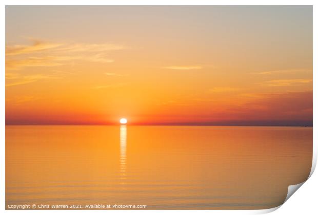 Sun setting over a calm sea Print by Chris Warren