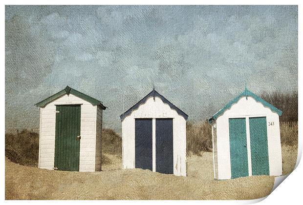Three Little Beach Huts Sitting on a Beach Print by Lesley Mohamad