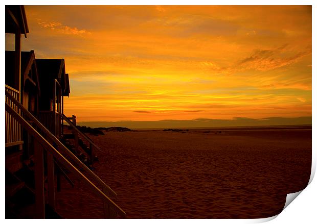 Sunset on the beach huts Print by Colin Brittain