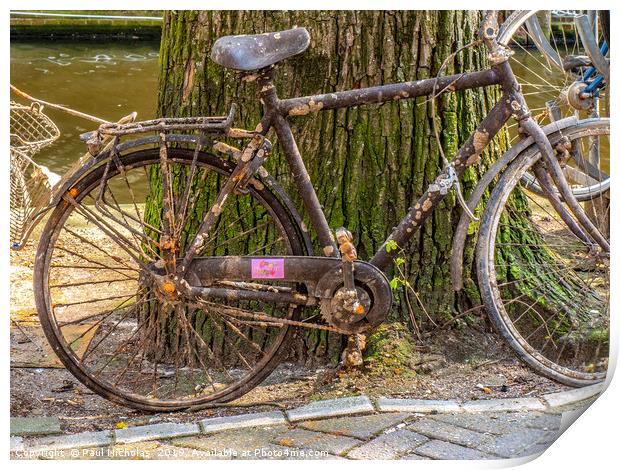 Abandoned bike on an Amsterdam canal-side Print by Paul Nicholas