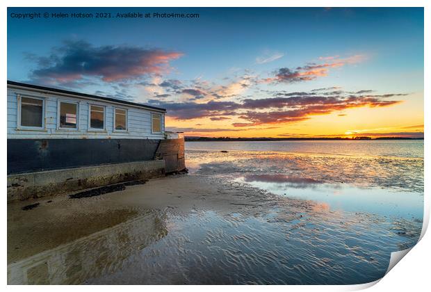Sunset over an old boat on Bramble Bush Bay at Studland in Poole Print by Helen Hotson