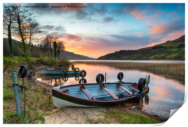 Beautiful sunrise over rowing boats at Glencar Lough Print by Helen Hotson