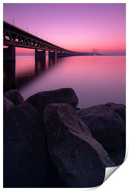 Oresunds Bridge and Rocky Shore at Sunset Print by Antony McAulay