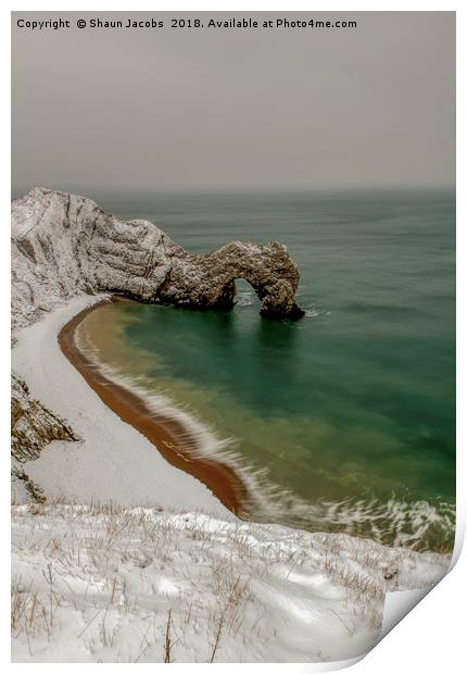 Durdle Door covered in snow  Print by Shaun Jacobs