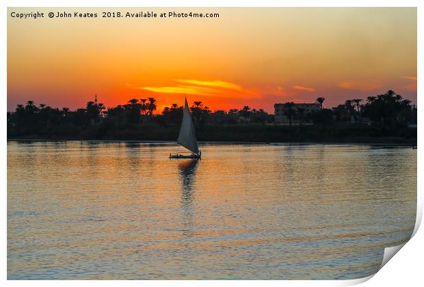 Sunset on the Nile River with Felucca boat sailing Print by John Keates