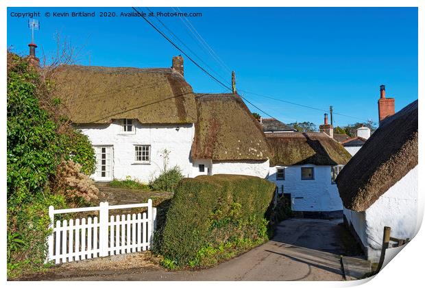 Thatched roof cottages Print by Kevin Britland