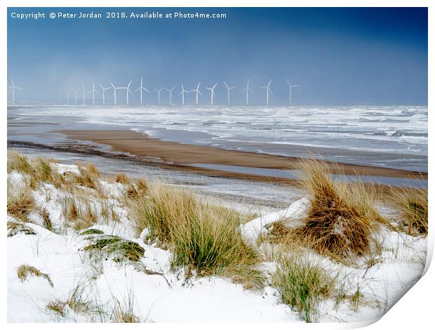 Cold conditions on a deserted beach with snowy cli Print by Peter Jordan