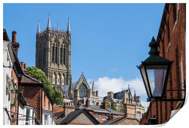 Lincoln cathedral peaking above the rooftops of the city Print by Jason Wells