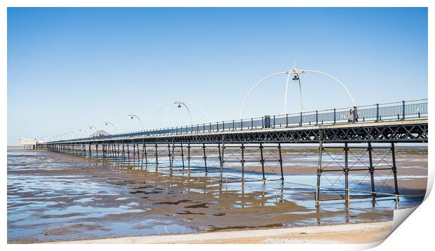 Southport Pier reflecting in pools of water Print by Jason Wells