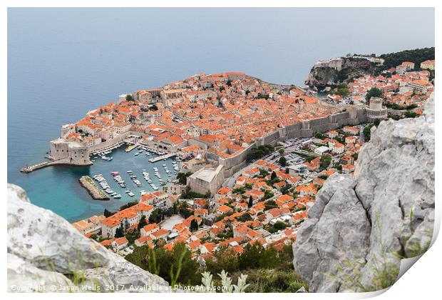 Dubrovnik seen between the rocks on Srd hill Print by Jason Wells