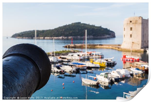 Cannon faces out over the harbour Print by Jason Wells