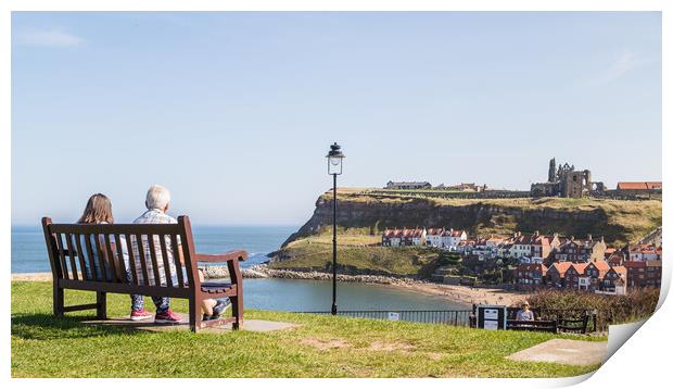Couple on a bench overlooking Whitby harbour Print by Jason Wells