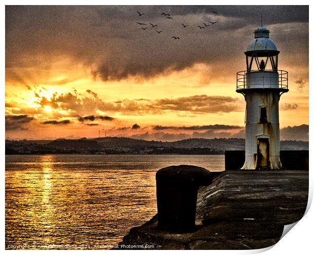 Dramatic sunset over Brixham Lighthouse Print by Ann Biddlecombe