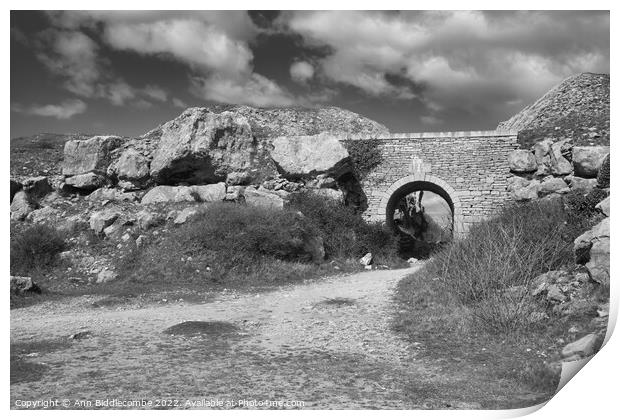Stone archway at Portland Quarry in black and white Print by Ann Biddlecombe