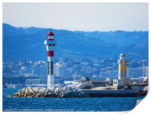 Helicopter landing next to Lighthouse Print by Ann Biddlecombe