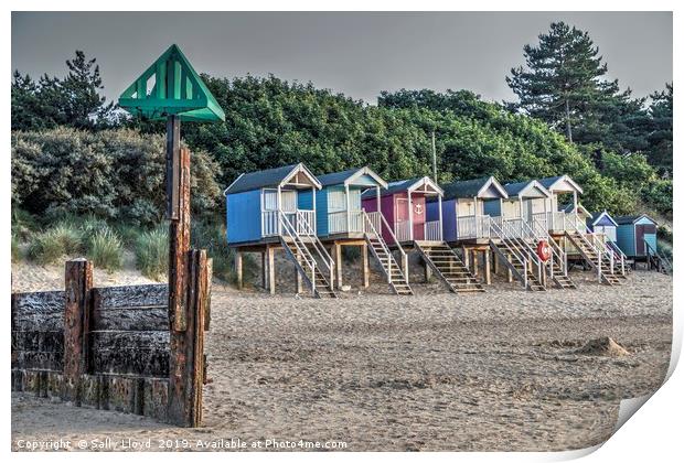 Beach huts and marker at Wells next the Sea, Norfo Print by Sally Lloyd