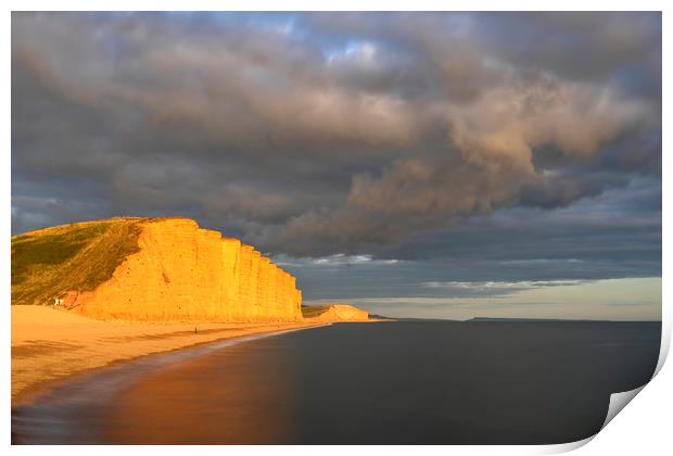 Storm clouds over East Cliff (West Bay) Print by Andrew Ray