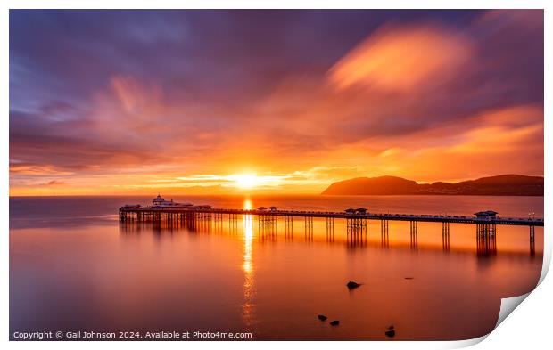 Sunrise over llandudno Pier with the tide in  Print by Gail Johnson