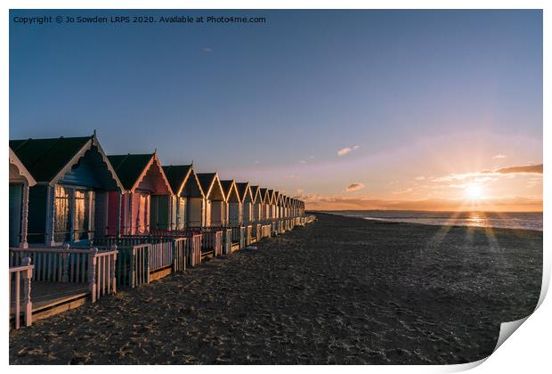 Sunset at West Mersea Beach Huts Print by Jo Sowden