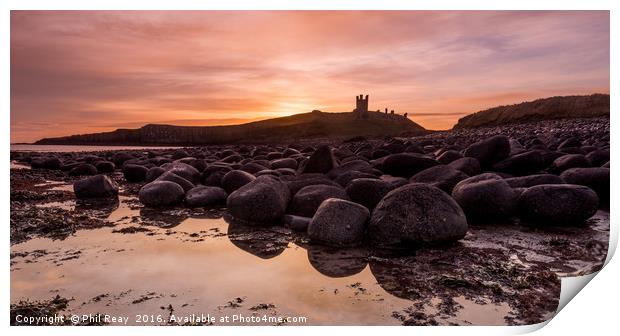 Dunstanburgh Castle at sunrise Print by Phil Reay