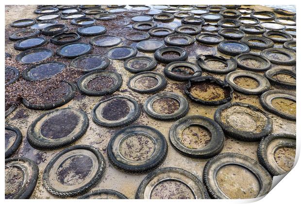 Sea Shore Covered With Old Rubber Tyres Print by Artur Bogacki