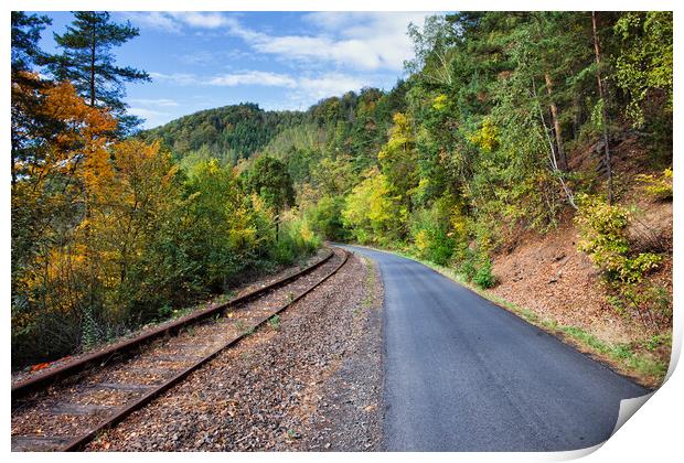 Rural Road and Railway Track Along Autumn Forest Print by Artur Bogacki