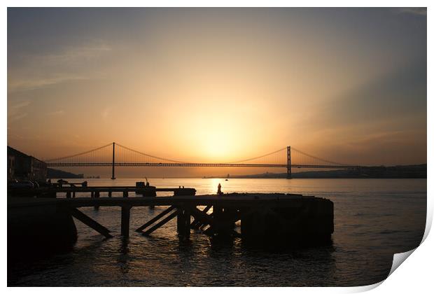 Sunset at Almada Quay and 25 de Abril Bridge in Lisbon Print by Artur Bogacki