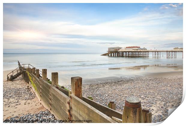 Cromer Pier in Norfolk England with beach groin Print by Simon Bratt LRPS