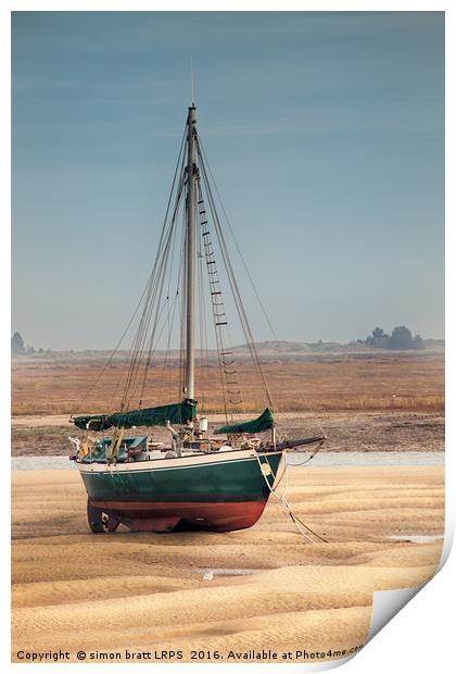 Sail boat stranded at low tide on sand Print by Simon Bratt LRPS