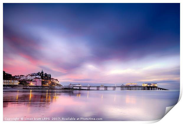 Famous Cromer pier in Norfolk England with pink su Print by Simon Bratt LRPS