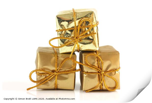 Three gold Christmas parcels Print by Simon Bratt LRPS