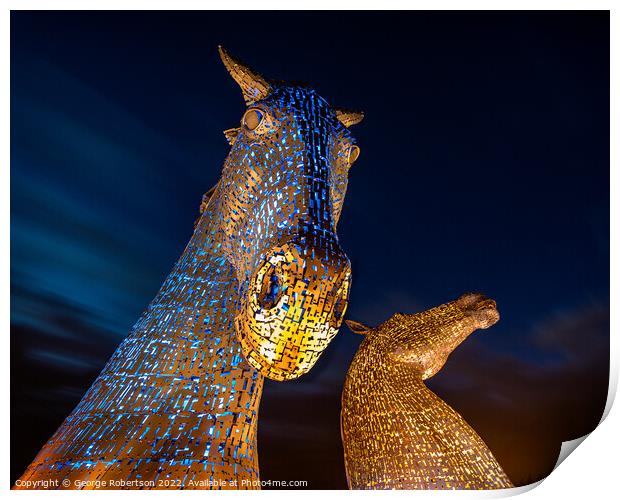 The Kelpies light up in Blue and Yellow colours in support of Uk Print by George Robertson