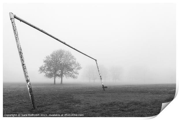 Goal posts and tree in a foggy London park Print by Sara Melhuish