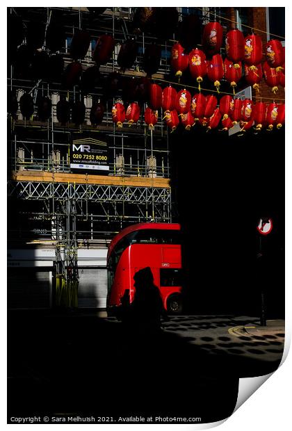 Red bus and lanterns Print by Sara Melhuish