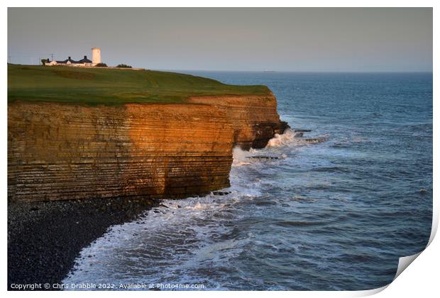 Nash Point and Lighthouse at sunset Print by Chris Drabble