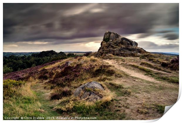Ashover Stone and moving clouds Print by Chris Drabble